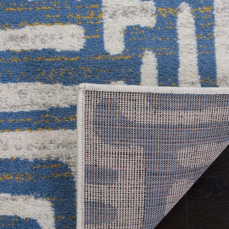 Ivory and Light Blue Geometric Low Pile Area Rug