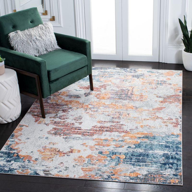 Ivory and Blue Abstract Hand-Knotted Synthetic Area Rug