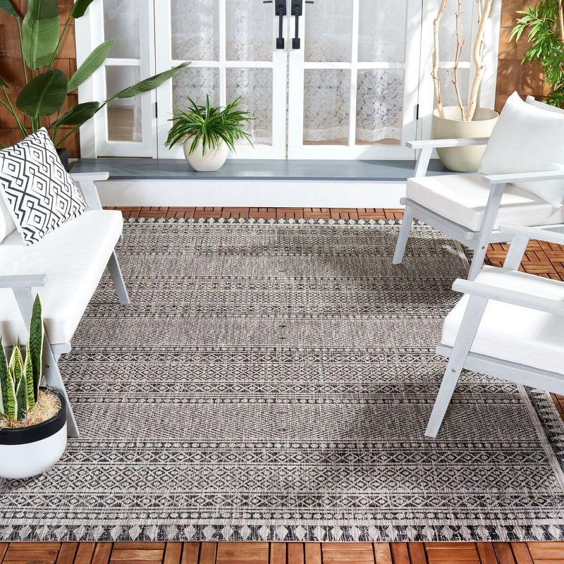 Black and Beige Rectangular Synthetic Area Rug