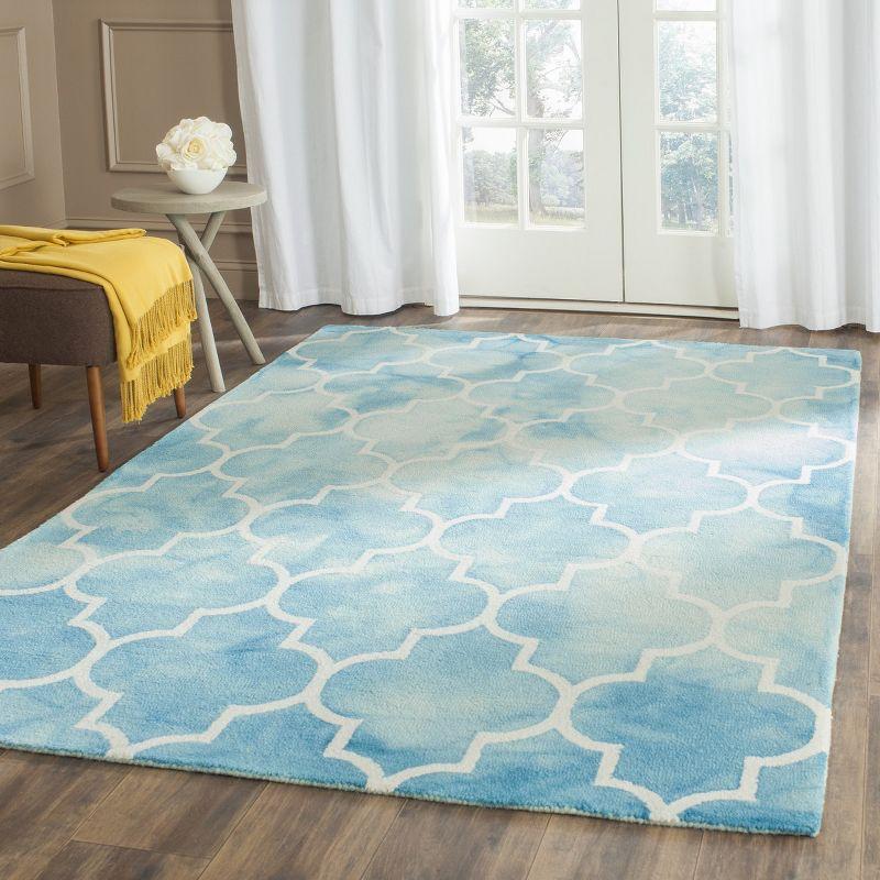 Ivory and Turquoise Hand-Tufted Wool 6' x 9' Area Rug