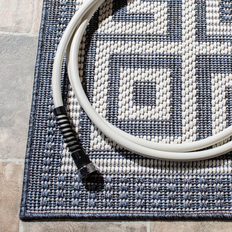 Bermuda BMU820 Power Loomed Indoor/Outdoor Area Rug - Dark Blue/Ivory - 8'9"x11'9" - Safavieh.