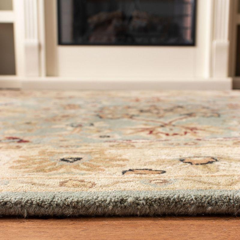 Antiquity AT249 Hand Tufted Area Rug - Light Blue/Ivory - 7'6"x9'6" Oval - Safavieh.