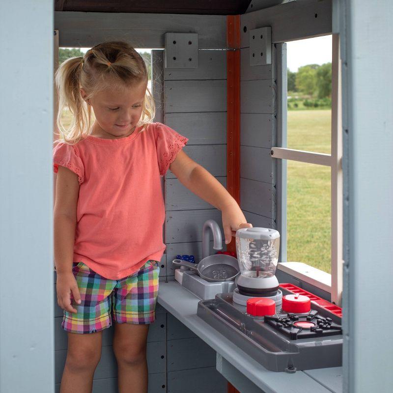 Backyard Discovery Backyard Discovery Beacon Heights Cedar Wooden Elevated Kids Playhouse with Wave Slide, Play Kitchen, and Deck