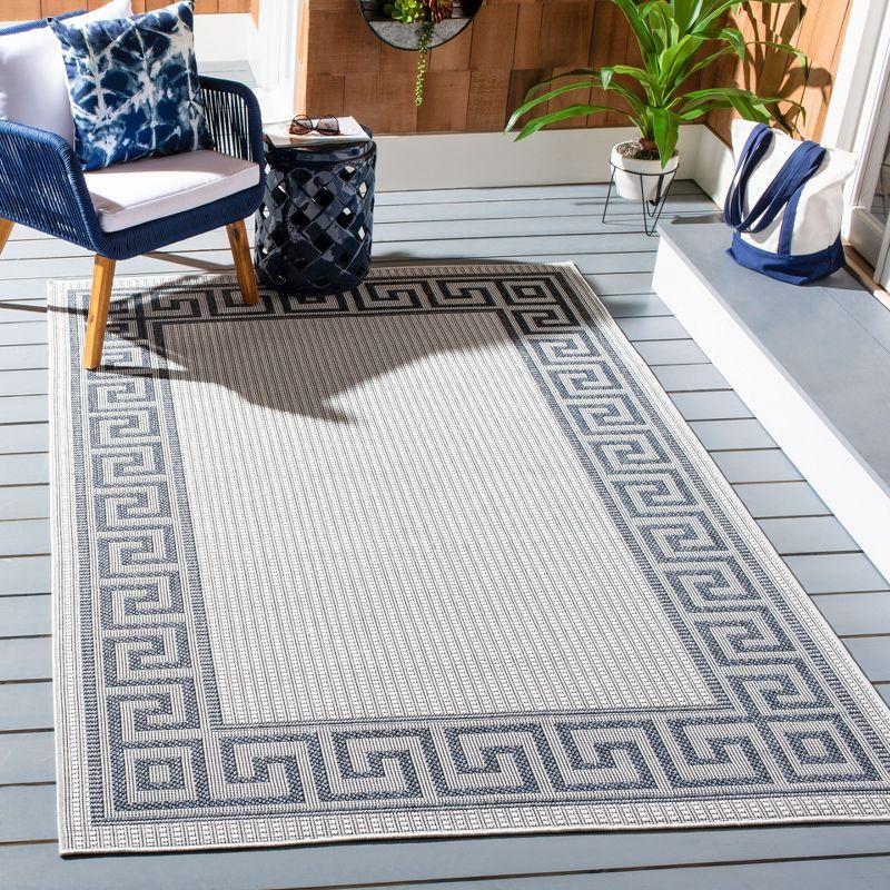 Bermuda BMU820 Power Loomed Indoor/Outdoor Area Rug - Ivory/Blue - 6'7"x9'2" - Safavieh.