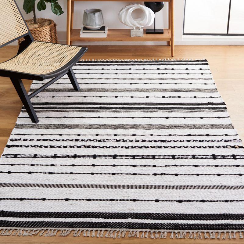 Boho Chic Black and Ivory Striped Kilim 5' x 8' Wool Area Rug