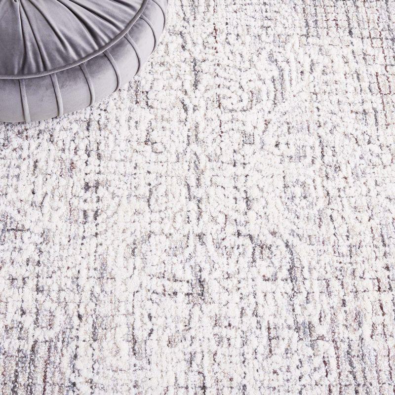 Ivory and Gray Tufted Wool 8' x 10' Area Rug