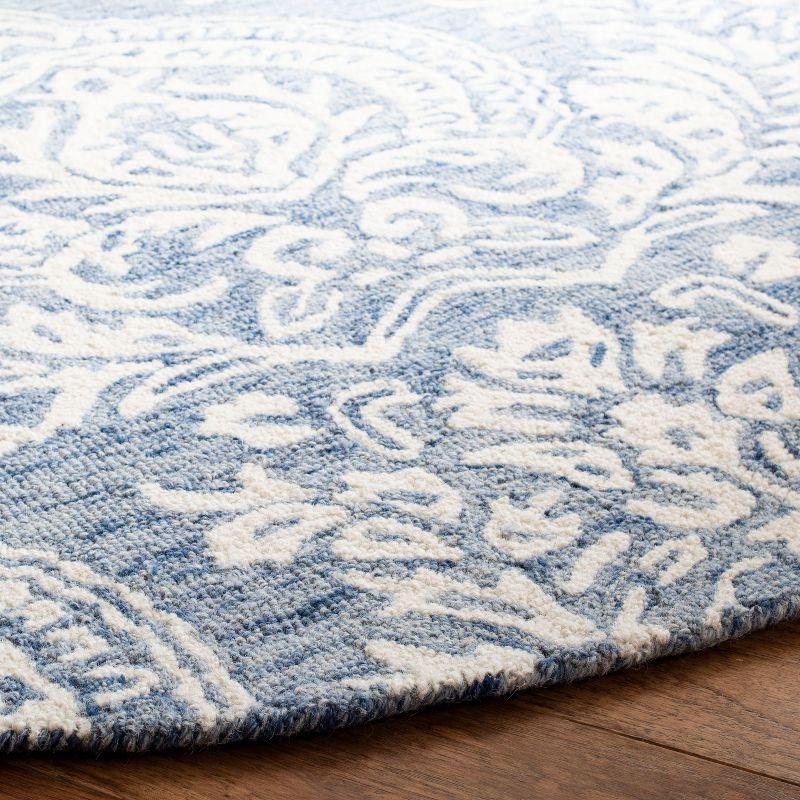 Handmade Blue and Ivory Wool Tufted Round Area Rug