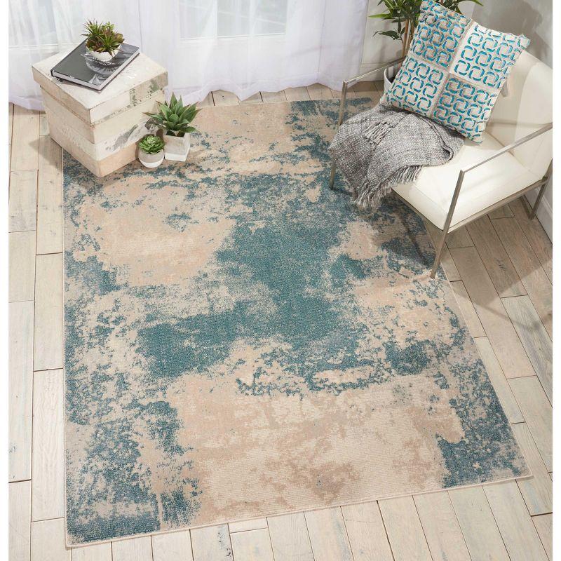 Maxell Ivory/Teal Synthetic 9'3"x12'9" Easy Care Area Rug