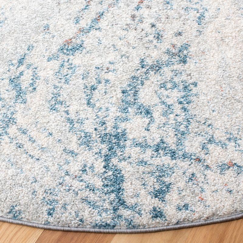 Ivory and Blue Abstract Round Synthetic Area Rug