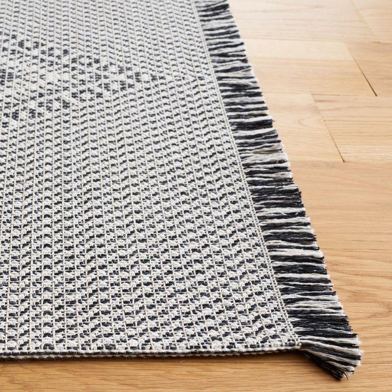 Augustine Black and Ivory Flat Woven 8' x 10' Area Rug