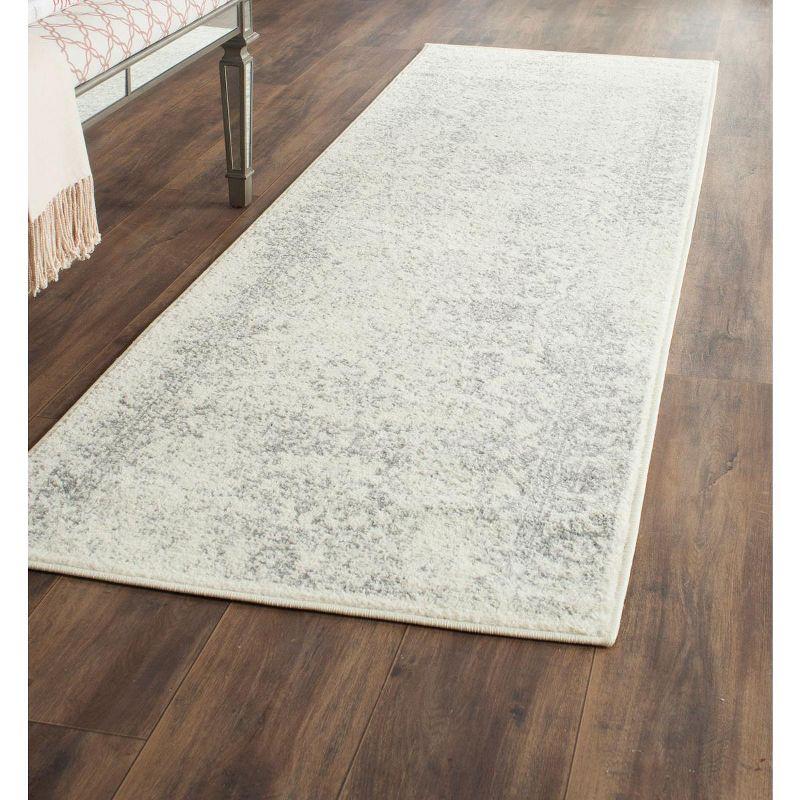 Chic Ivory and Silver Synthetic 30" Reversible Area Rug