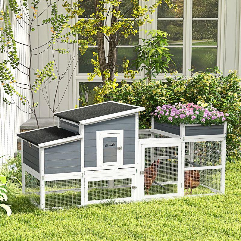 Gray and White Wooden Chicken Coop with Flower Bed