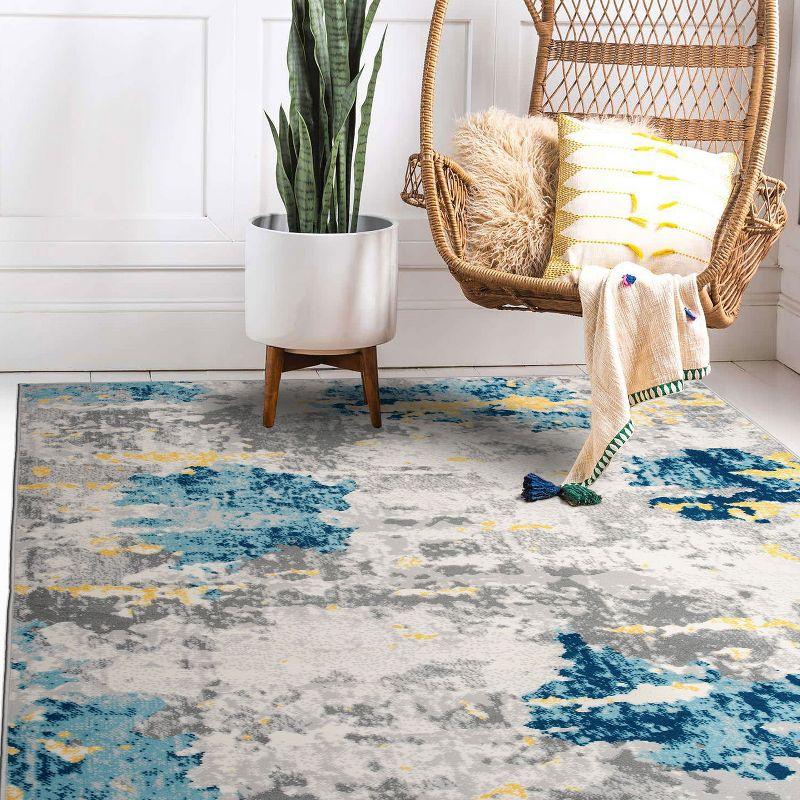 Cream and Blue Abstract Synthetic 5' x 7' Area Rug