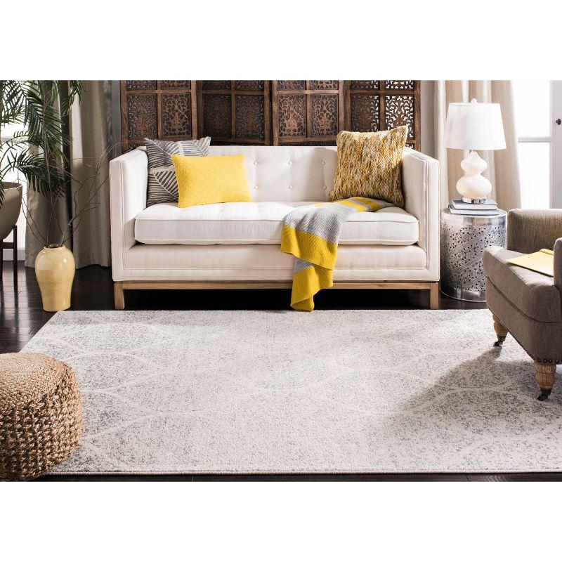 Ivory and Silver Geometric 8' x 10' Synthetic Area Rug