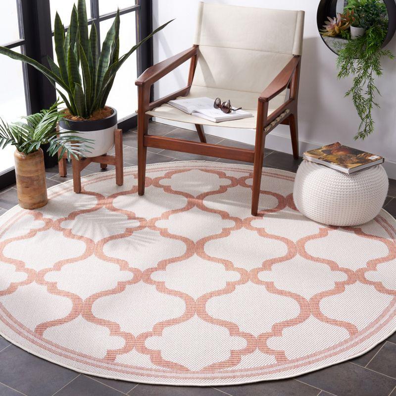 Rust and Ivory Round Synthetic Flat Woven Rug