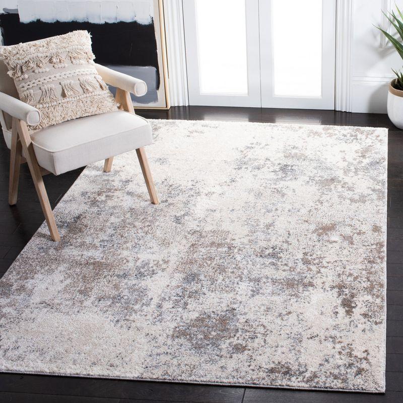 Ivory and Grey Abstract 6' x 9' Synthetic Area Rug