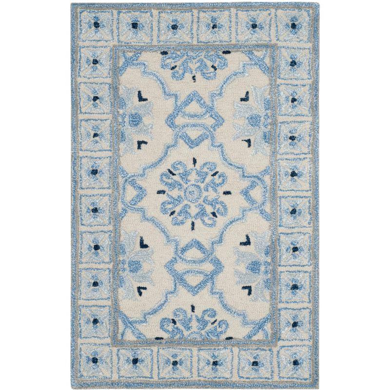 Handmade Ivory and Blue Wool Viscose Tufted Area Rug