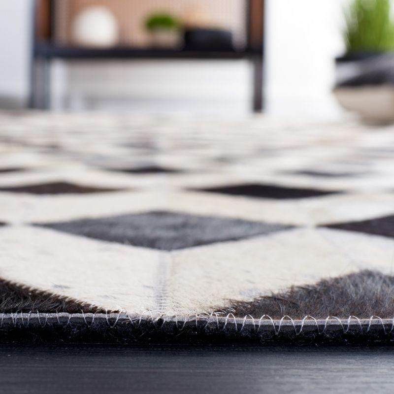 Handmade Black and Beige Geometric Cowhide Rug