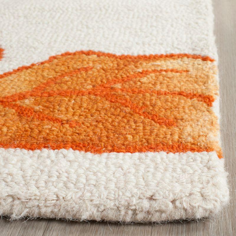 Handmade Ivory and Orange Tufted Wool Accent Rug 2' x 3'