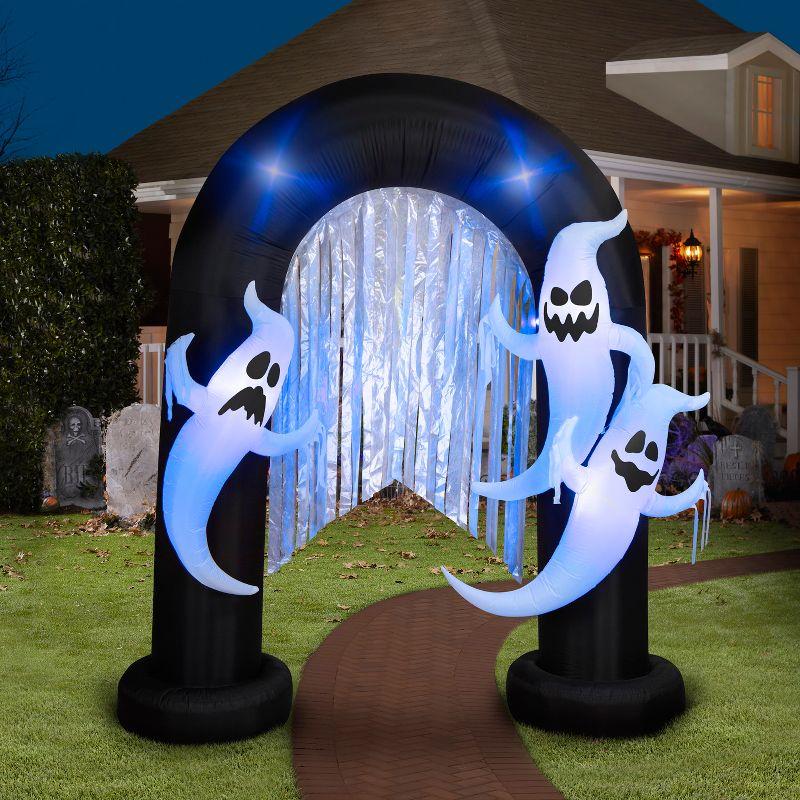 Gemmy Halloween Inflatable Ghost Archway with Flickering Black Lights and Metallic Streamers, 9 ft Tall