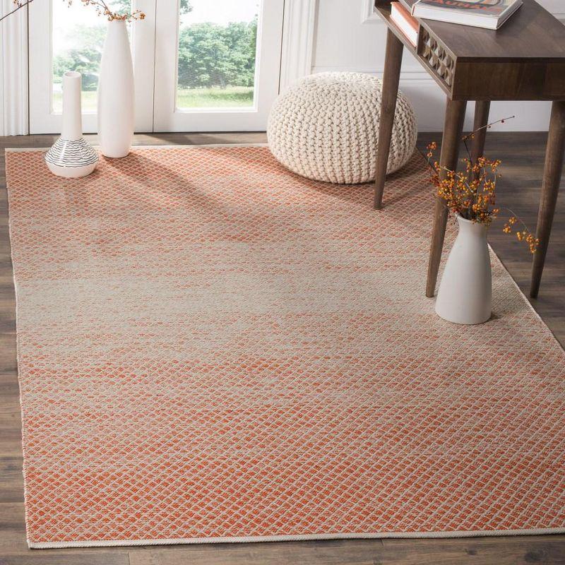 Ivory and Orange Handwoven Cotton Area Rug, 5' x 8'