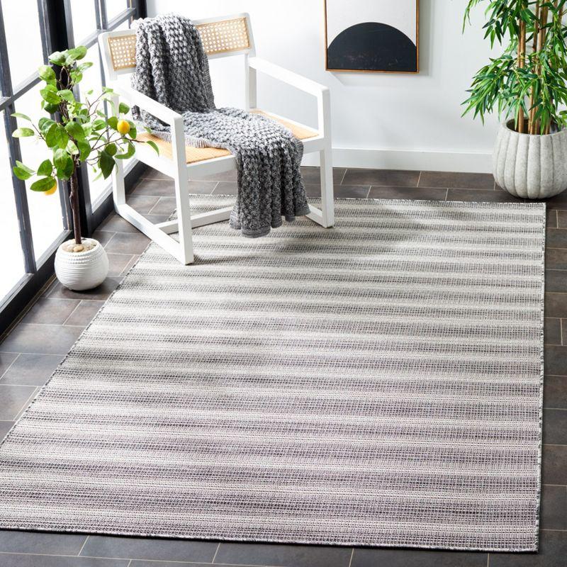 Elegant Hampton 4' x 6' Black/Ivory Synthetic Indoor/Outdoor Area Rug