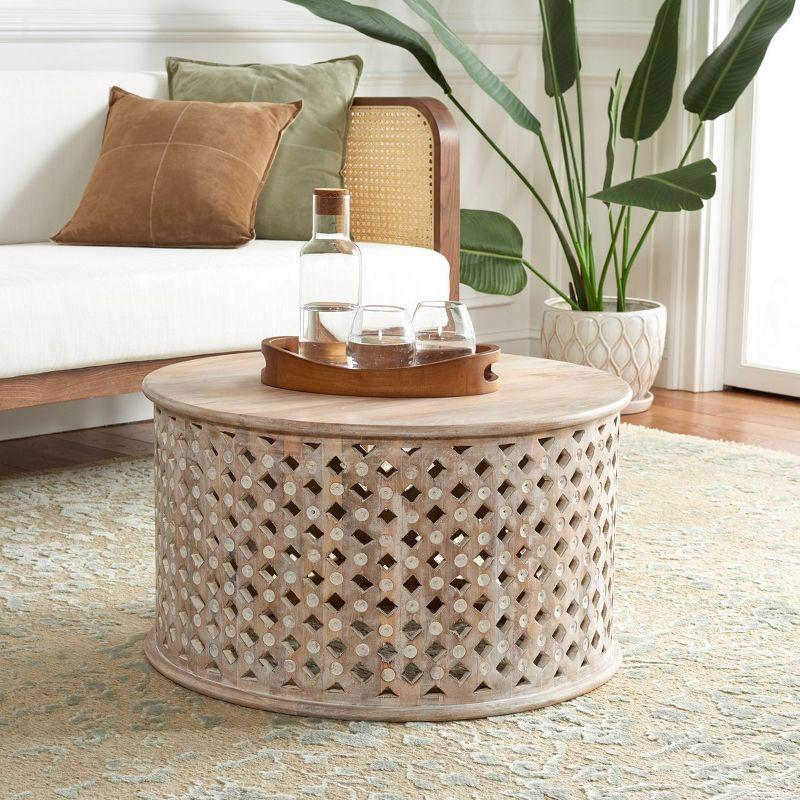 Kyrith Round Coffee Table - Burnt White - Safavieh