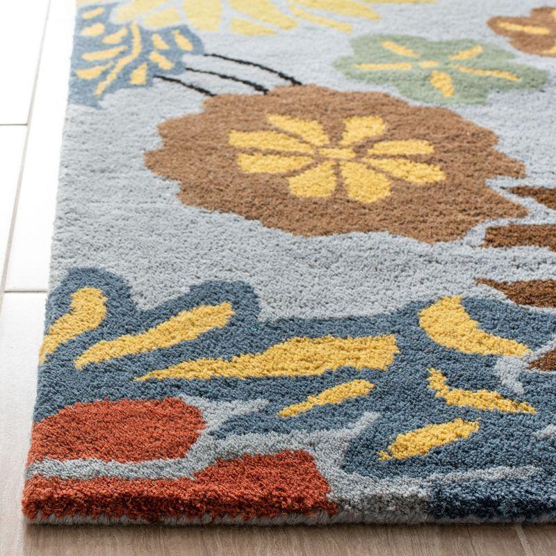 Soho SOH738 Hand Tufted Area Rug - Blue/Multi - 8'3"x11' - Safavieh.
