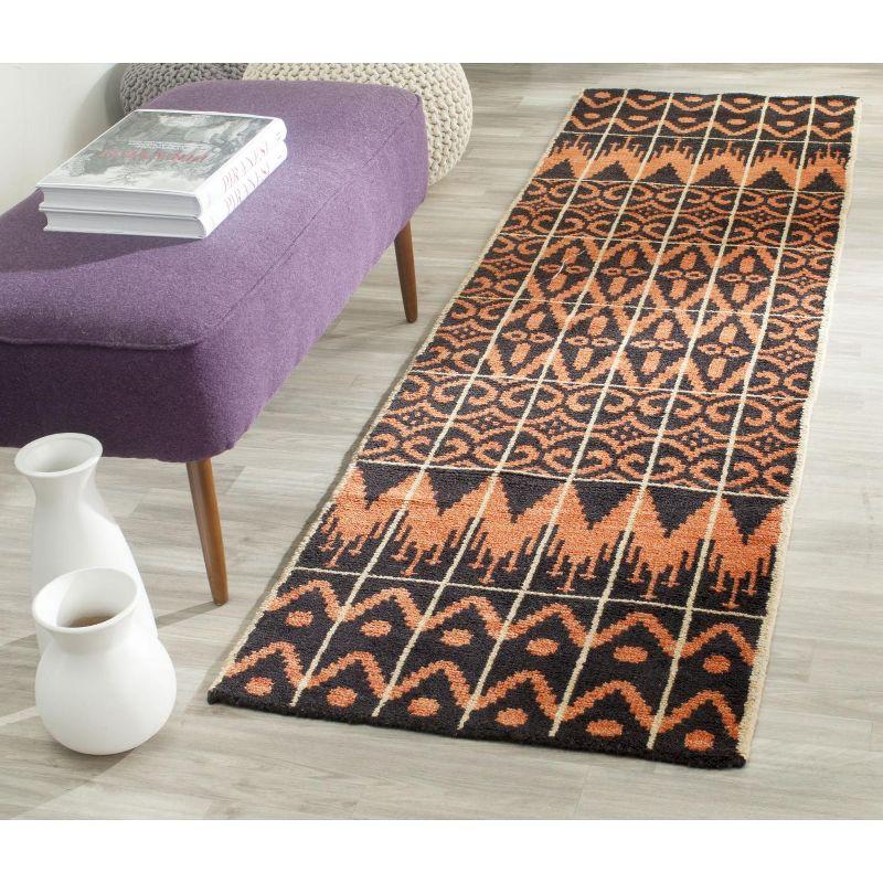 Union Rustic Alimatou Hand Knotted Wool/Cotton Southwestern Rug in Orange/Black