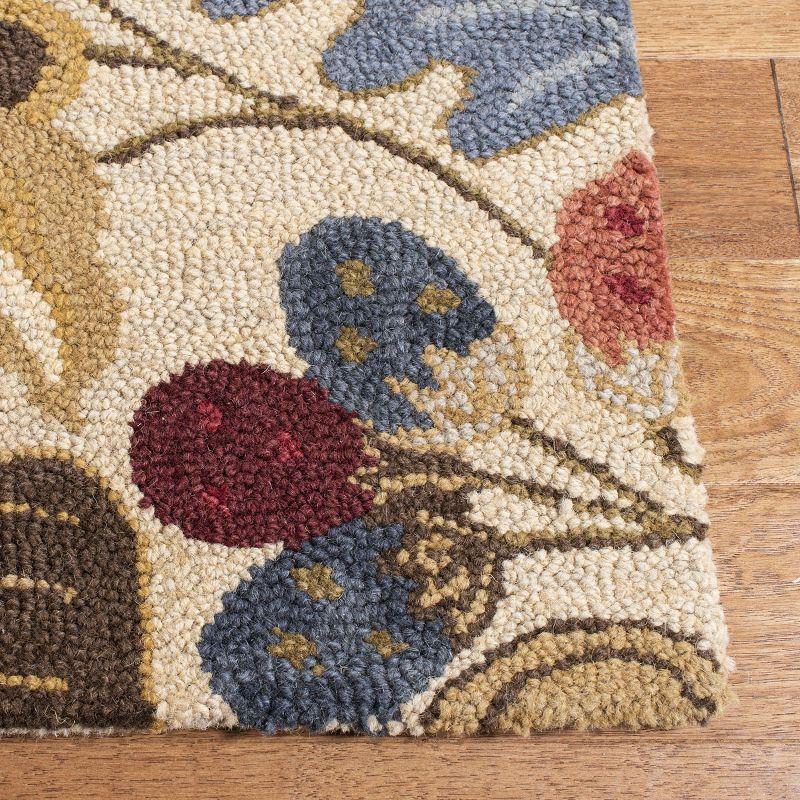 Handmade Beige and Multi Floral Wool Area Rug