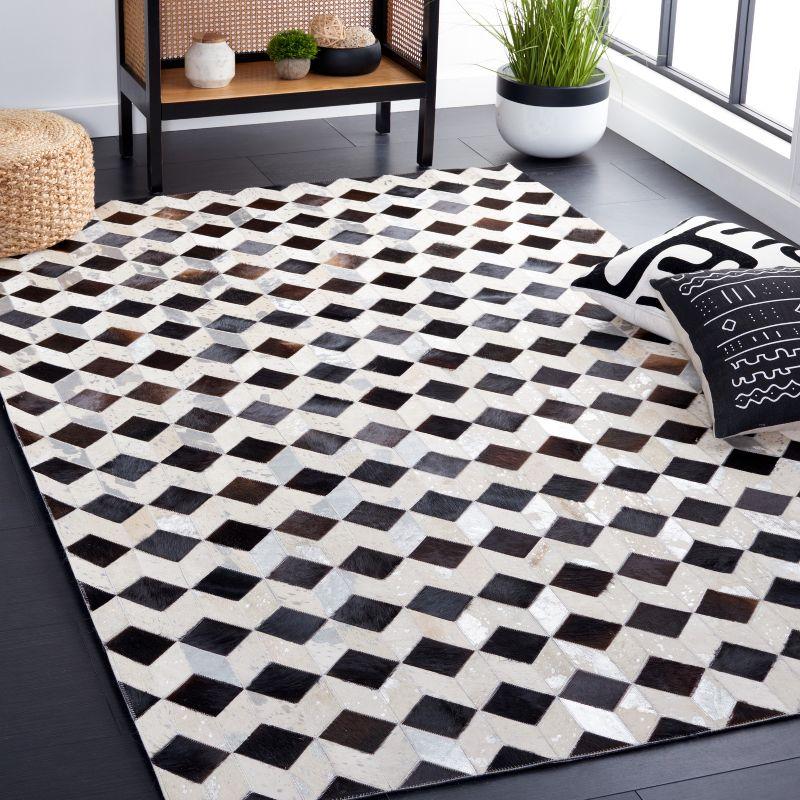 Handmade Black and Beige Geometric Cowhide Rug