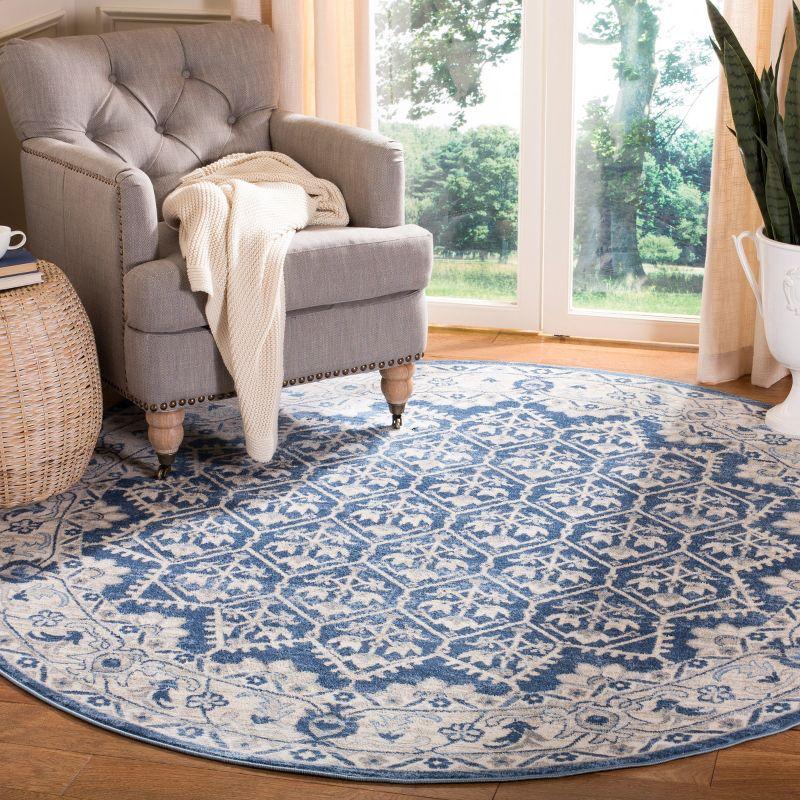 Ivory and Blue Round Synthetic Hand-Knotted Rug