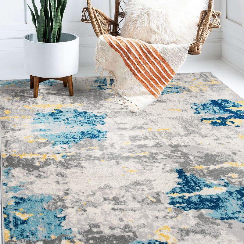 Cream and Blue Abstract Synthetic 5' x 7' Area Rug