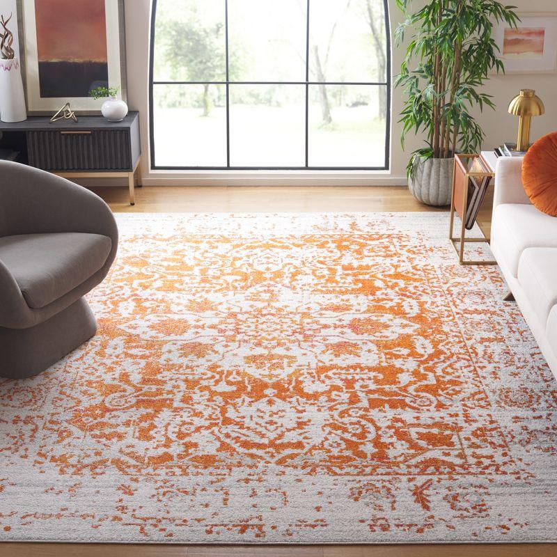 Ivory and Orange Rectangular Synthetic Area Rug