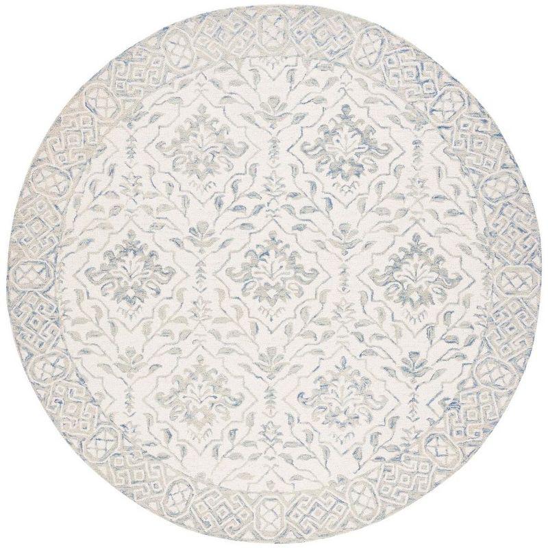 Handmade Light Blue and Ivory Round Wool Area Rug