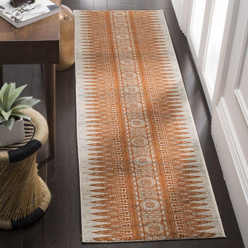 Evoke EVK226 Power Loomed Accent Rug Ivory / Orange 2'-2" X 4' - Safavieh.