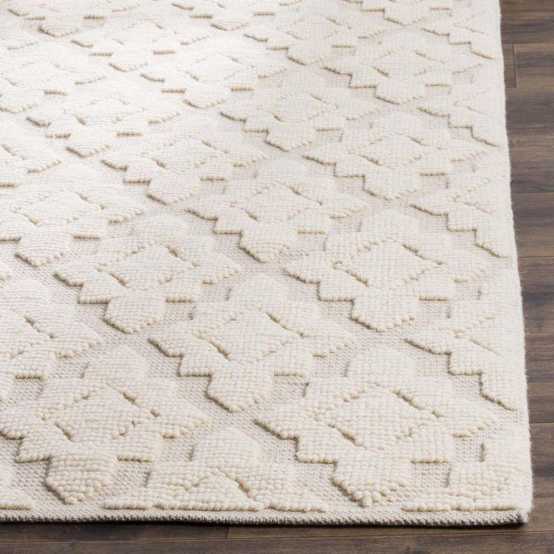 Ivory Handwoven Wool and Synthetic 6' x 9' Area Rug