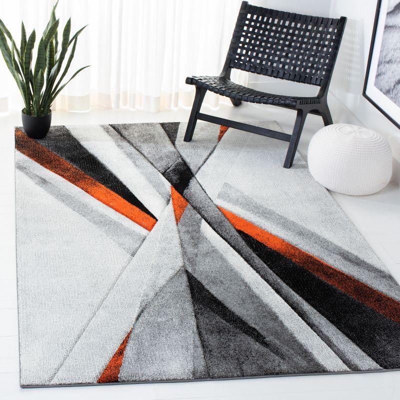 Hollywood HLW710 Machine Made Area Rug - 9'x12' - Grey/Orange - Safavieh