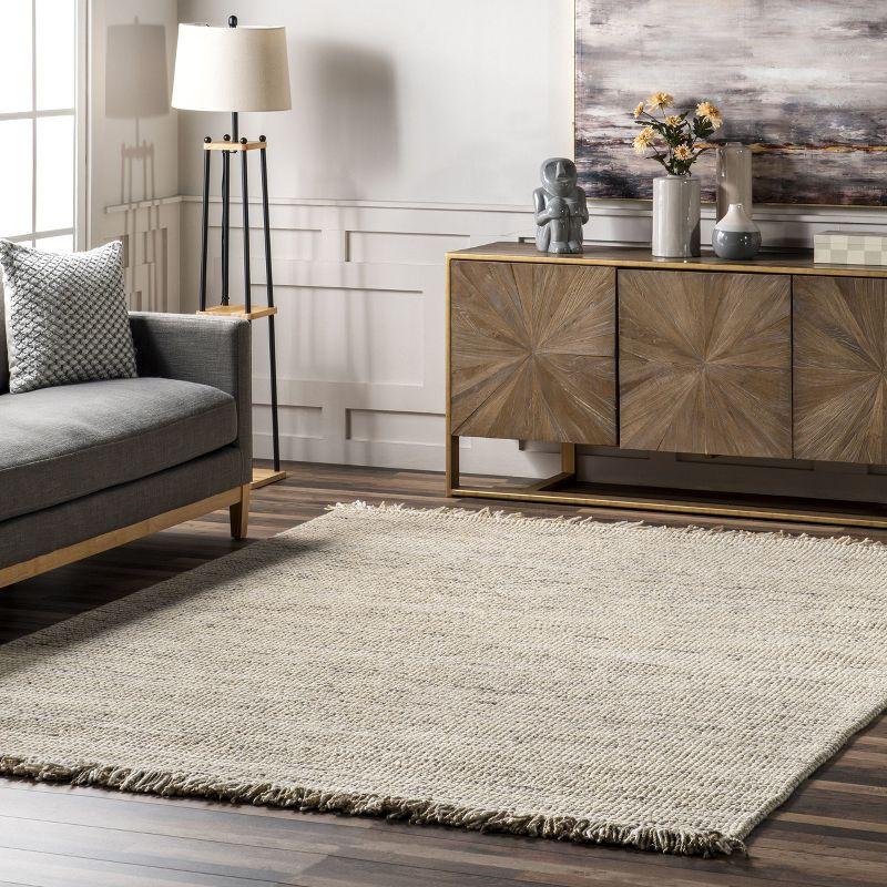 Handwoven Ivory Wool 7'6" x 9'6" Easy-Care Area Rug