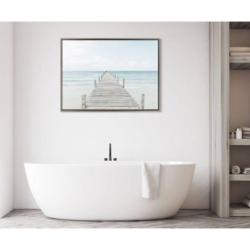 28" x 38" Sylvie Wooden Pier on Beach Framed Canvas Gray - Kate & Laurel All Things Decor