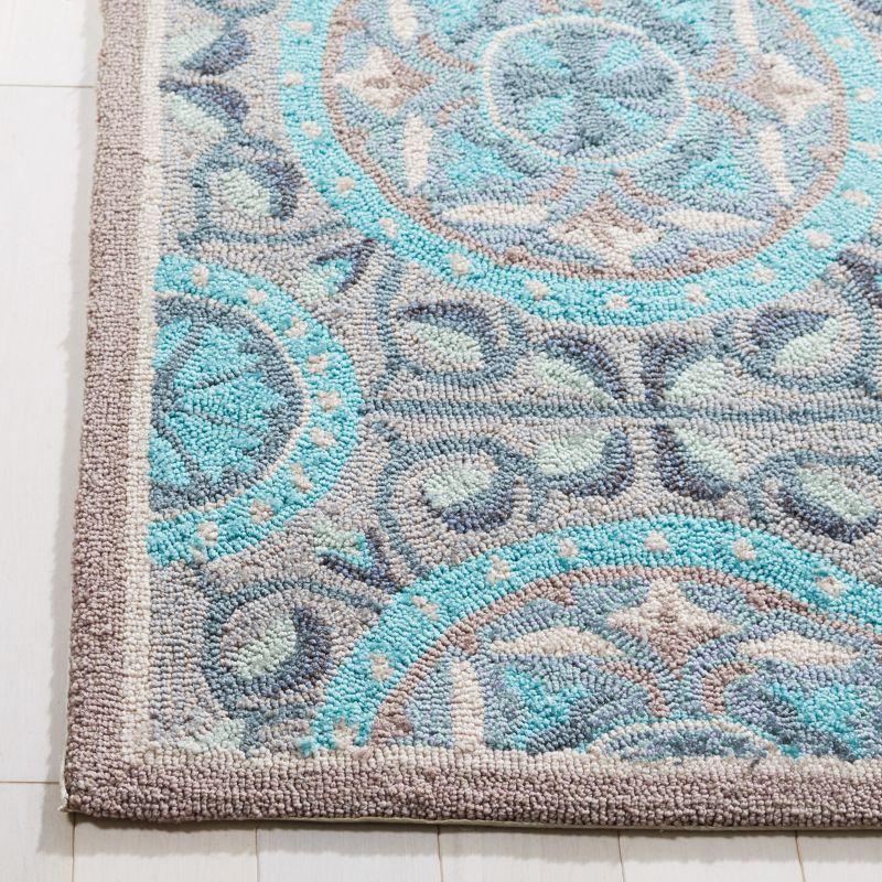 Mint Aqua Floral Hand-Hooked Synthetic Area Rug 6' x 9'