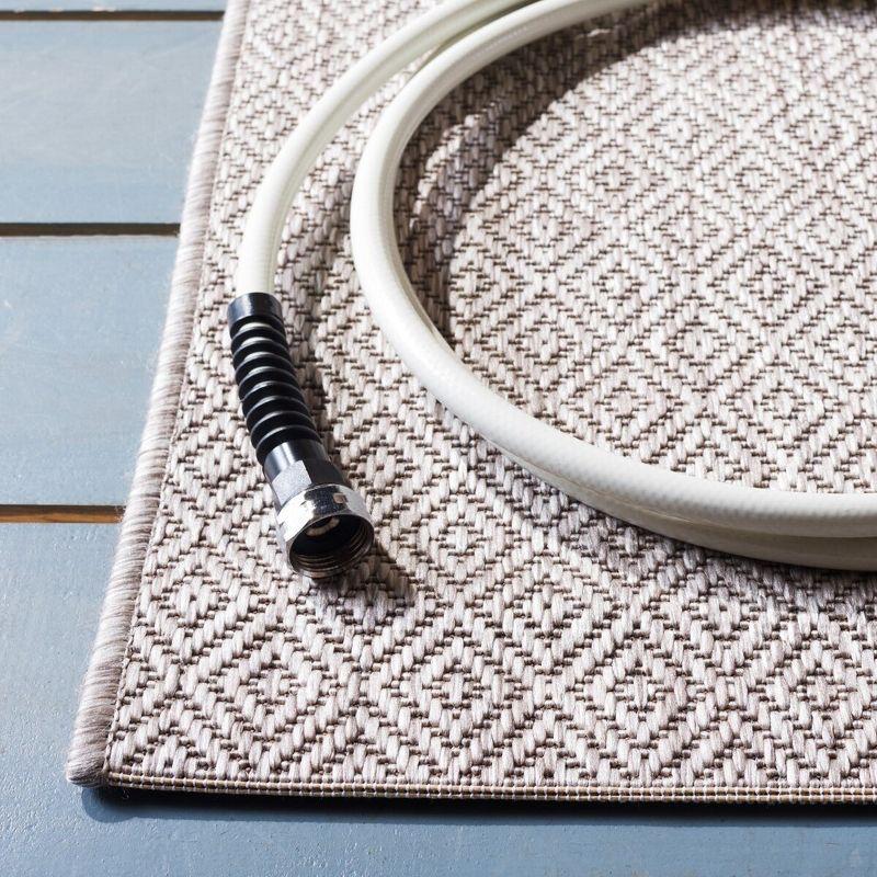 Elegant Beige Synthetic 27'' Indoor/Outdoor Easy-Care Runner Rug