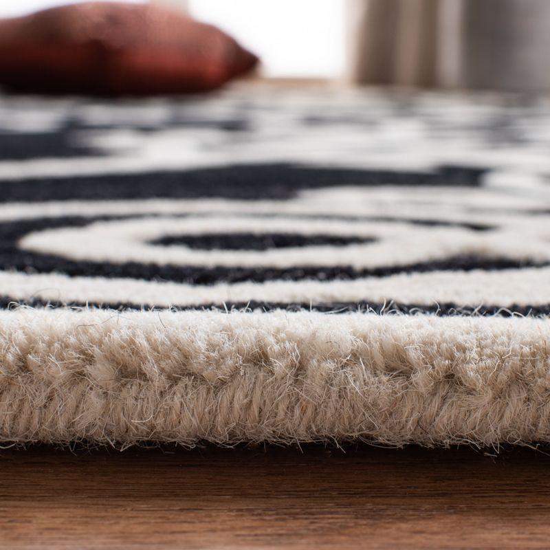 Handmade Black and Ivory Tufted Wool Area Rug, 8'3" x 11'