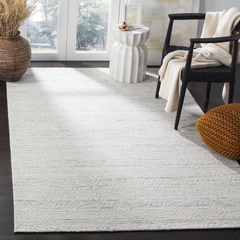 Ivory and Light Blue Hand-Tufted Wool Area Rug, 5' x 8'