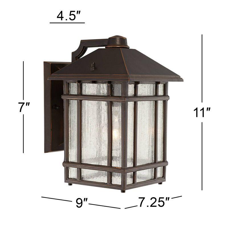 Kathy Ireland Bronze 11" Outdoor Wall Light with Frosted Seeded Glass