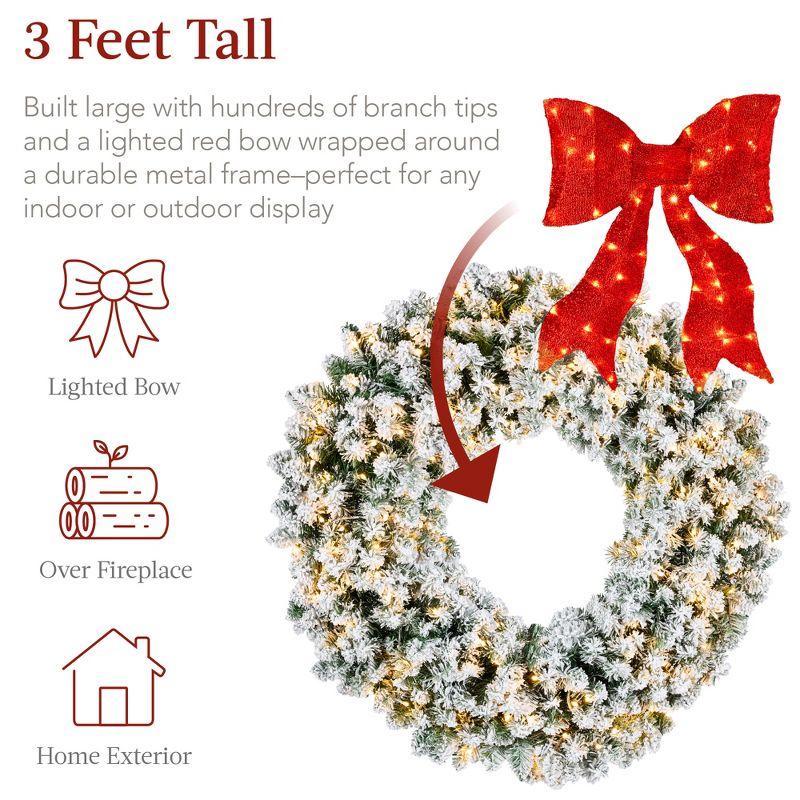 Best Choice Products Artificial Pre-Lit Flocked Fir Christmas Wreath Décor w/ Red Bow, LED Lights, Tips, Plug-In