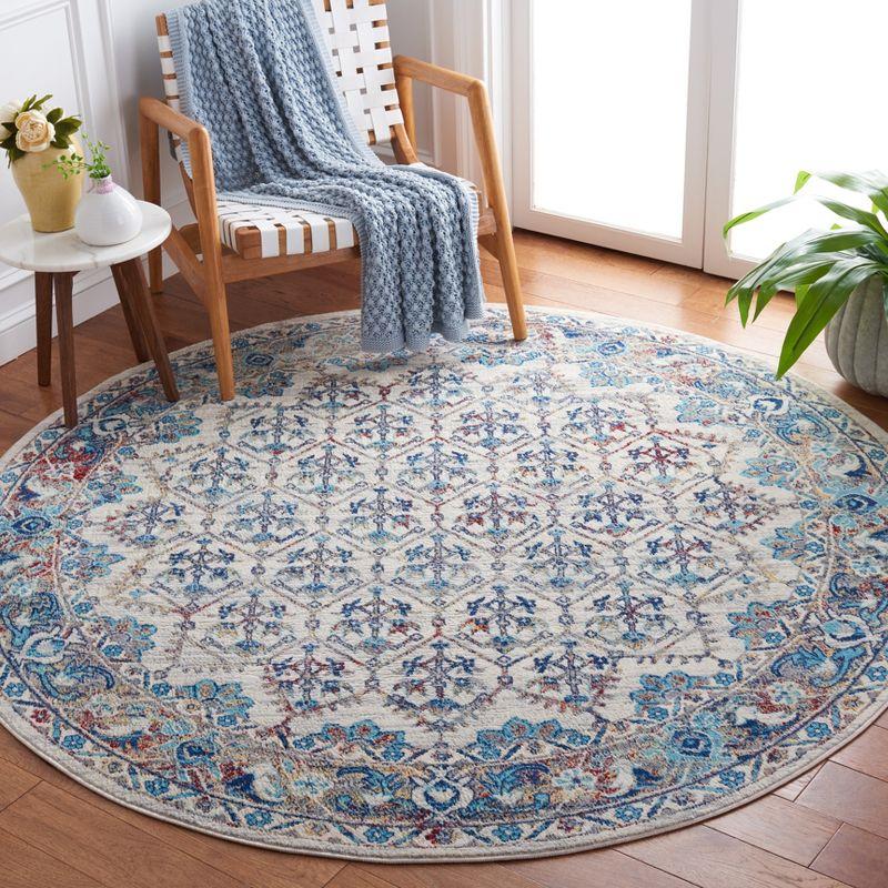 Ivory and Blue Round Synthetic Hand-Knotted Rug