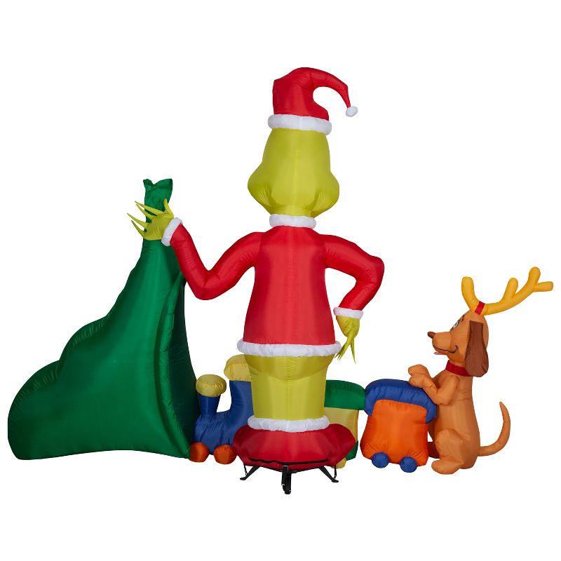 Grinch Christmas Airblown Inflatable Putting Train in Santa Sack Scene Dr. Seuss, 6.5 ft Tall