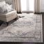 Ivory Blue Hand-Knotted Synthetic 6'7" x 9' Area Rug