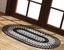 Black and White Oval Braided Synthetic Area Rug 8' x 10'